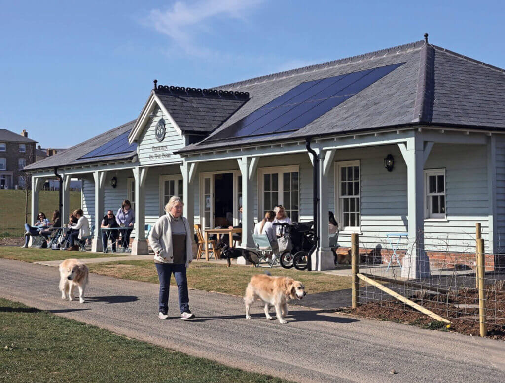 The Pavilion Café on the Great Field, Poundbury. Recently completed and already a hugely popular community hub powered by solar PV and Tesla battery. Home to the Alcohol Education Trust.